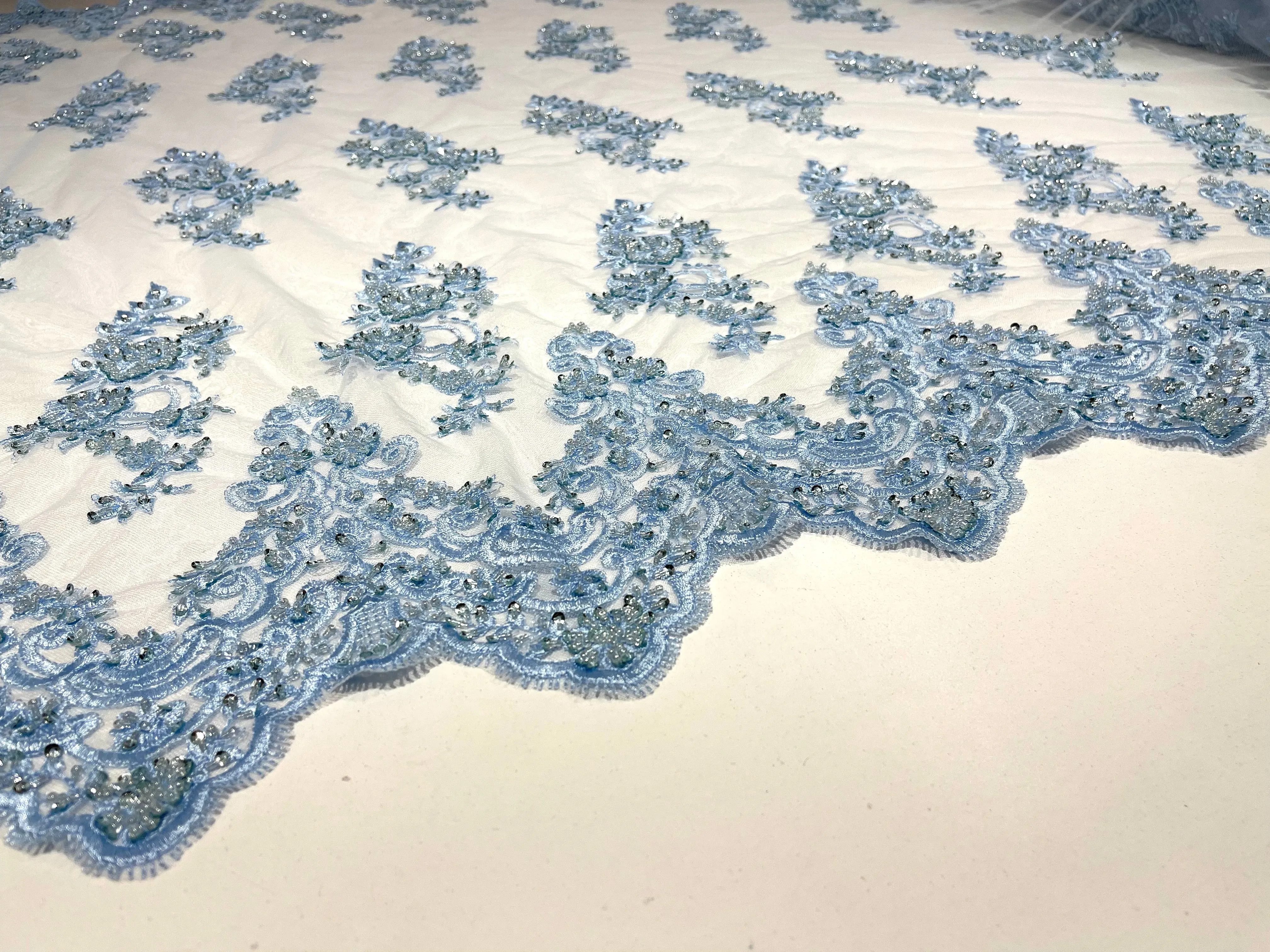 Light Blue elegant hand beaded flower design embroider on a mesh lace-prom-sold by the yard.