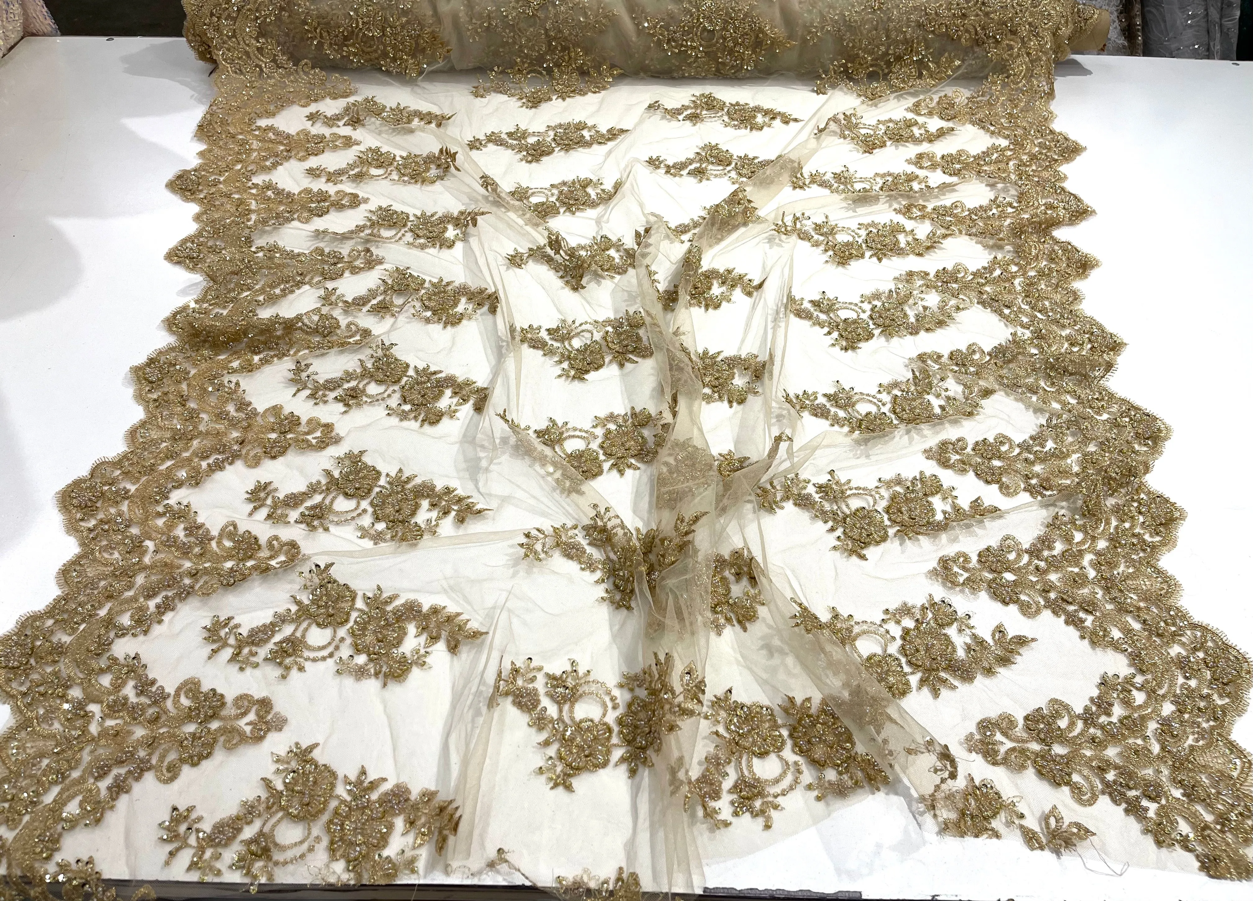 Metallic Gold elegant hand beaded flower design embroider on a mesh lace-prom-sold by the yard.